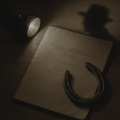 Vintage script titled 'Final Rehearsal Copy' with a horseshoe on a wooden surface.